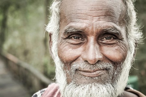 Sunderban, Bangladesh, circa July 2012: Old native man with white beard and hair wears colourful