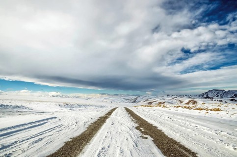 Winter snow-covered road in the Caucasus mountains a wide angle