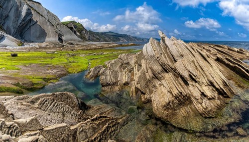 A view of the Flysch rock formations and cliffs with tidal pools on the Basque Country coast near