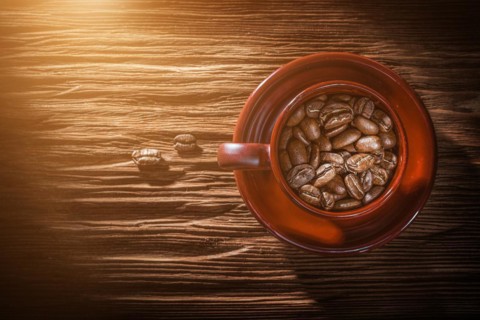 Coffee grain cup saucer on vintage wooden board
