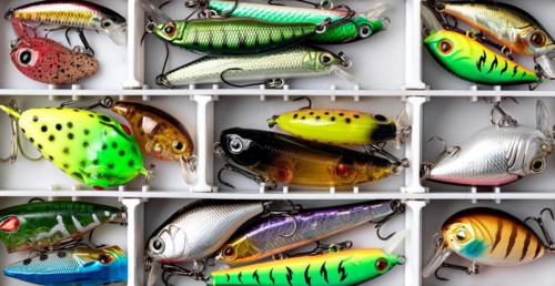 hard silicone lures in a box isolated on white