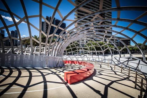 The iconic architecture of Webb Bridge on a warm spring morning in the Docklands area of Melbourne,