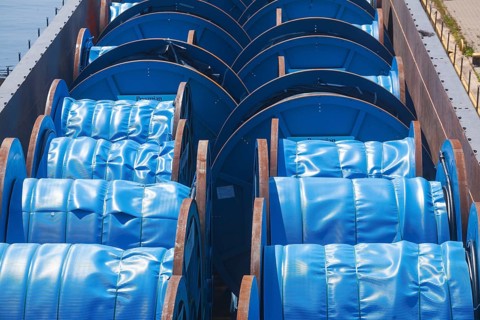 Inland waterway vessel with cargo of blue cable barrels, Hoya, Lower Saxony, Germany, Europe