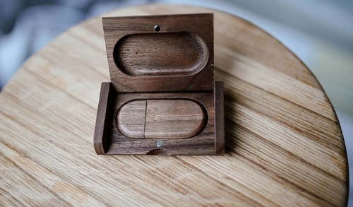 An open wooden case with light wood and minimal style on a wooden tabletop, highlighting natural