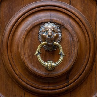 Close up of rustic old door in Florence, Italy, Europe