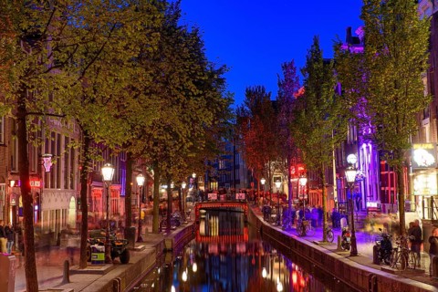 Night view of De Wallen, the famous red-light district with window prostitution in Amsterdam,