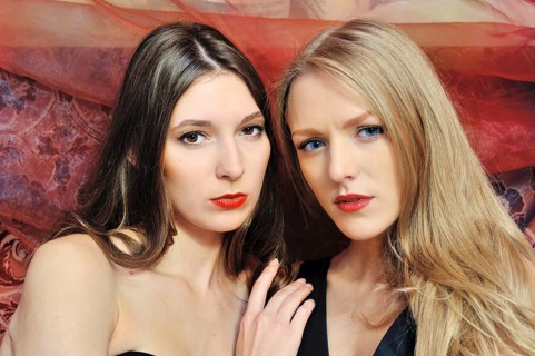 Portrait of the two beautiful women in an oriental interior