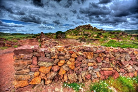 Masonry stonewall in spring with flowers at Menorca Balearic islands