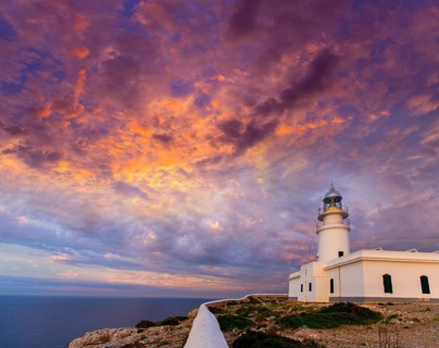 Menorca sunset in Faro Far de Caballeria Lighthouse at Balearic Islands es Mercadal