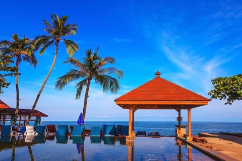 Rest of the Andaman Sea. Popular resort on the island of Koh Samui. Pool surrounded by palm trees