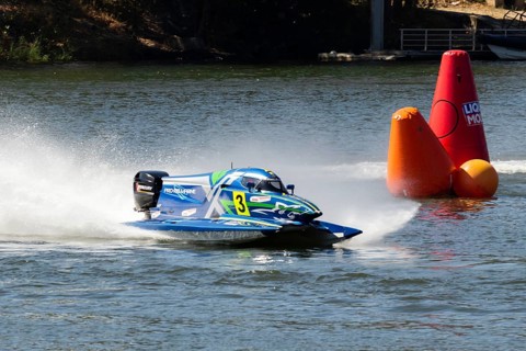 PESO DA REGUA, PORTUGAL - SEPTEMBER 15, 2024: Blue Powerboat Goes Fast with Splashes of Water