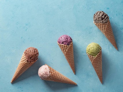 Various ice cream scoops in cones with copy space. Colorful ice cream in cones chocolate,