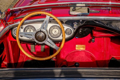 Lisbon, Portugal, Jan 20, 2024: All-red interior of Austin-Healey 100 vintage convertible sports