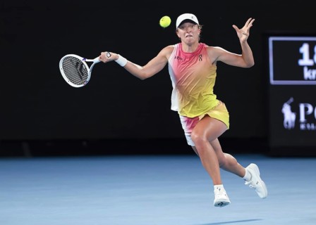 Polish tennis player Iga Swiatek playing a forehand shot at the Australian Open 2025 tournament,