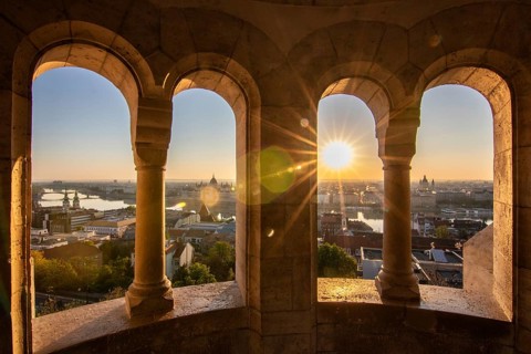 Old historic fortress and church at sunrise. City panorama at dusk. View of the Danube Fishermen's