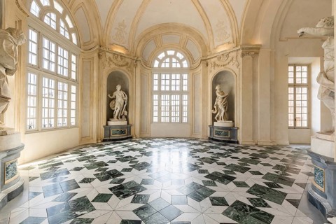 Venaria Reale, Italy, January 2023: luxury interior old royal palace. Gallery perspective with