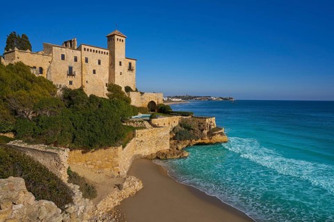 Cala La Jovera beach under Tamarit castle in Tarragona of Catalonia