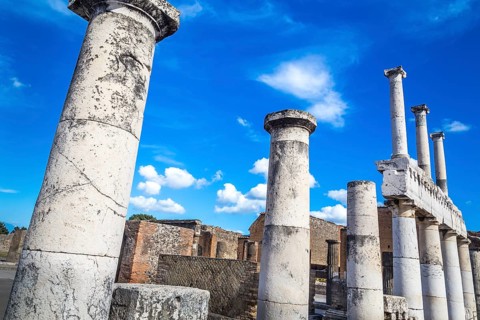 Pompeii in Italy, ruins of the antique Temple of Apollo with bronze Apollo statue, Naples