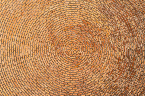 Red brick vault. Ceiling. Architectural Texture. Brick background Circular pattern