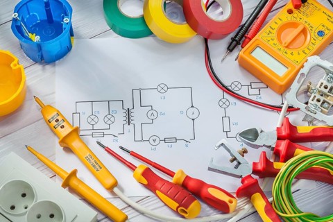 Electrical tools big set on white painted wooden boards background