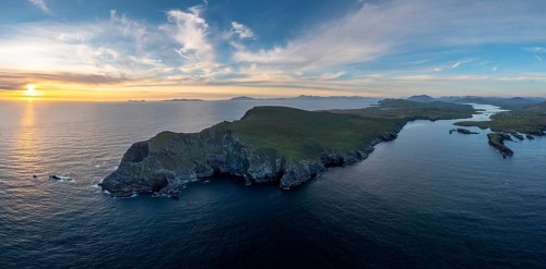 An aerial panorama view of the Bray Head cliffs and headland on Valentia Island at sunset