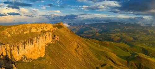 Aerial panorama view of plateau Bermamyt and hills at sunset, North Caucasus mountains, Russia,