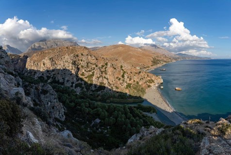 A picture of the Preveli Beach and the Preveli Palm Forest, as well as the nearby landscape and