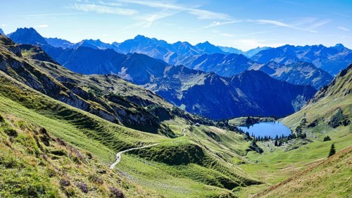 Oberstdorf, panoramic view over the mountains in glorious summer weather, bright blue sky