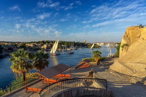 Beautiful landscape with felucca boats on Nile river in Aswan at sunset, Egypt, Africa