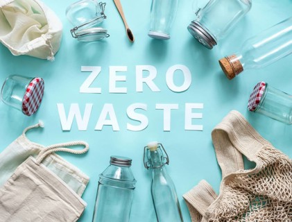 Zero waste concept. Textile eco bags, glass jars and bamboo toothbrush on blue background with Zero
