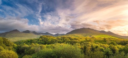Large panorama with amazing sunset and dramatic sky at the foothill of Carrauntoohil mountain,