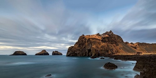 The coast and the ocean of Vestmannaeyjar island and the Elephant rock, Iceland, Europe