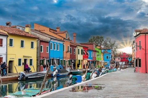 Colorful Houses in Burano beneath a scenic sky, Island of Venice, Italy, Europe