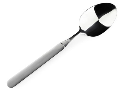 Single soup spoon over the white background