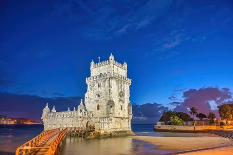 Lisbon Portugal, night city skyline at Belem Tower