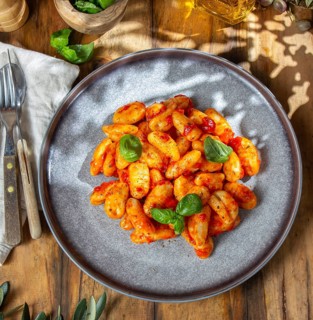 Food, Italian Gnocchi with tomato sauce and basil on wooden background