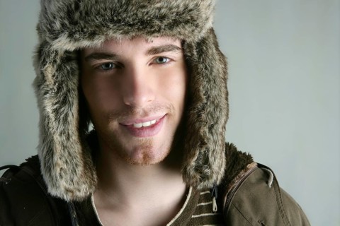 Fur winter fashion hat young man brown autumn color