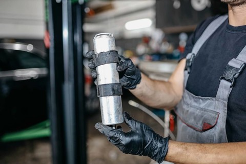 Car repair in car service fuel filter replacement