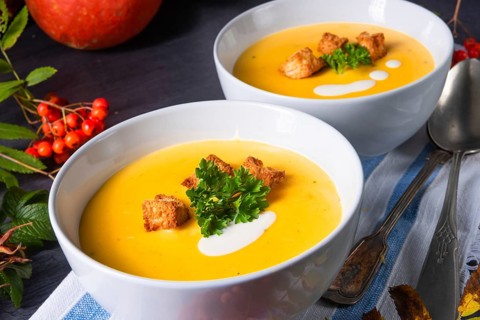 Delicious pumpkin soup with croutons and coconut milk