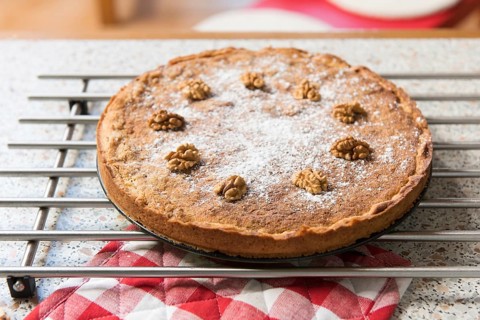 Baked walnut cake in kitchen