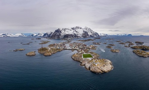Henningsvaer Fishing Village and Festvagtind Mountain in Winter. Norwegian Sea. Lofoten Islands,