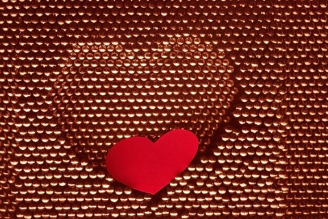 Red paper heart into steel herat shape. hand made by steel nail.