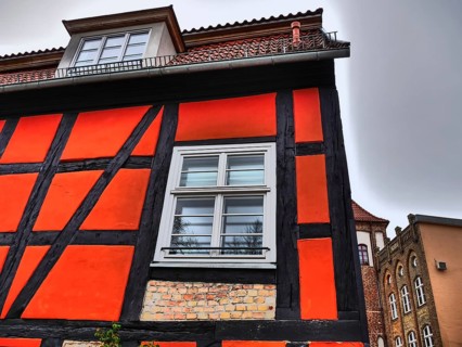 Historic half-timbered house with red and black beams and white windows, stralsund, mecklenburg,