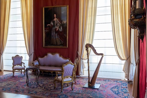 Venaria Reale, Italy, February 2023: luxury interior, old Royal Palace. Perspective with harp,