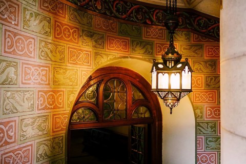 Antique wall lamp on a spiral staircase in Neuschwanstein Castle.