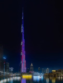 A picture of the iconic Burj Khalifa with its light show, and the surrounding Downtown Dubai