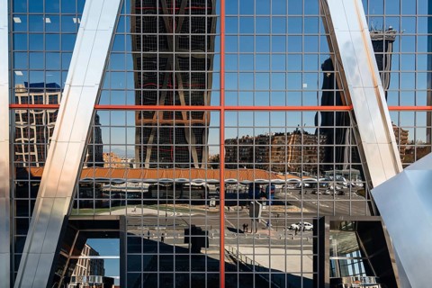 Madrid, Spain, March 20, 2017: Low angle view of The Gate of Europe towers and reflections. They