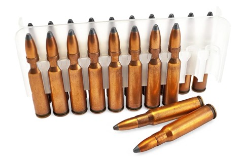 Packing ammunition for the automatic weapons and two cartridges lie separately isolated on a white
