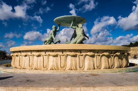 The famous Triton fountain, three bronze Tritons holding up a huge basin, in front of the City Gate
