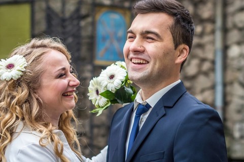 Newlyweds strolling around the city. Just married